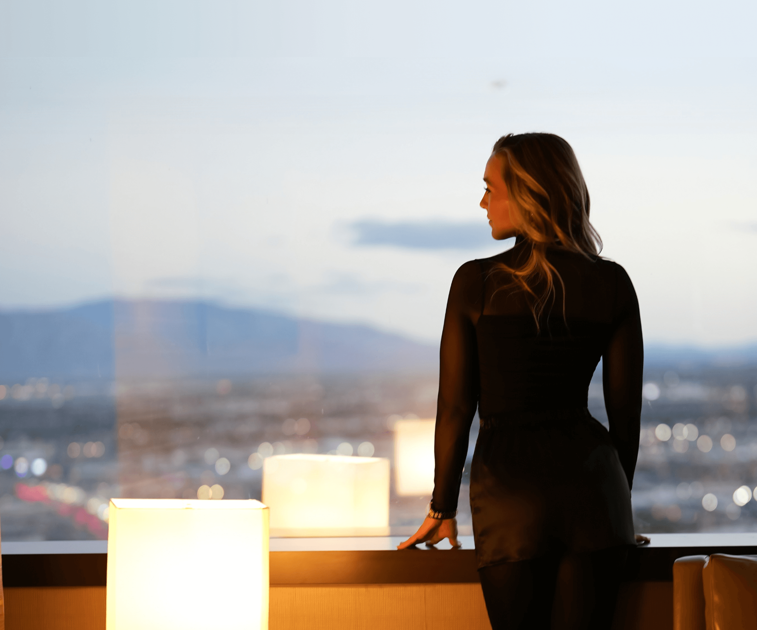 Laurin standing against a dramatic backdrop
